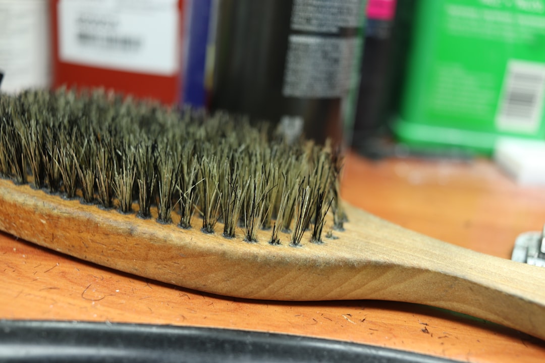 Master barber mentoring young apprentice